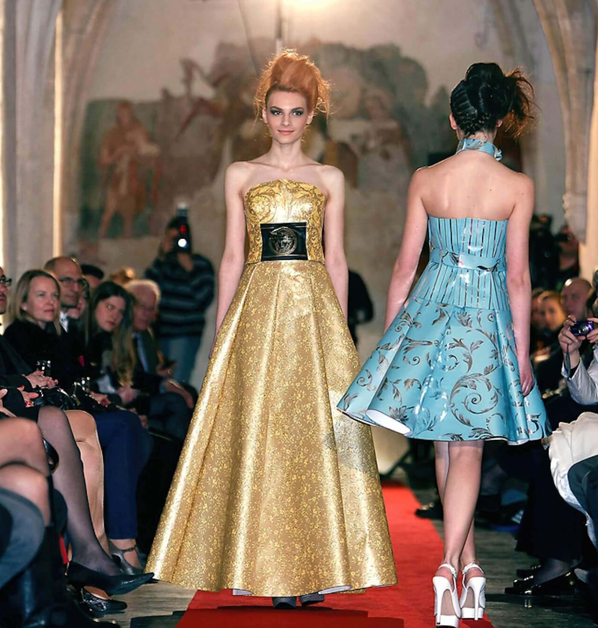 Runway models wearing couture dresses made from wallpaper at Toni Hamler’s Wall Art Fashion Show in the historic Dominican Monastery in Ptuj.