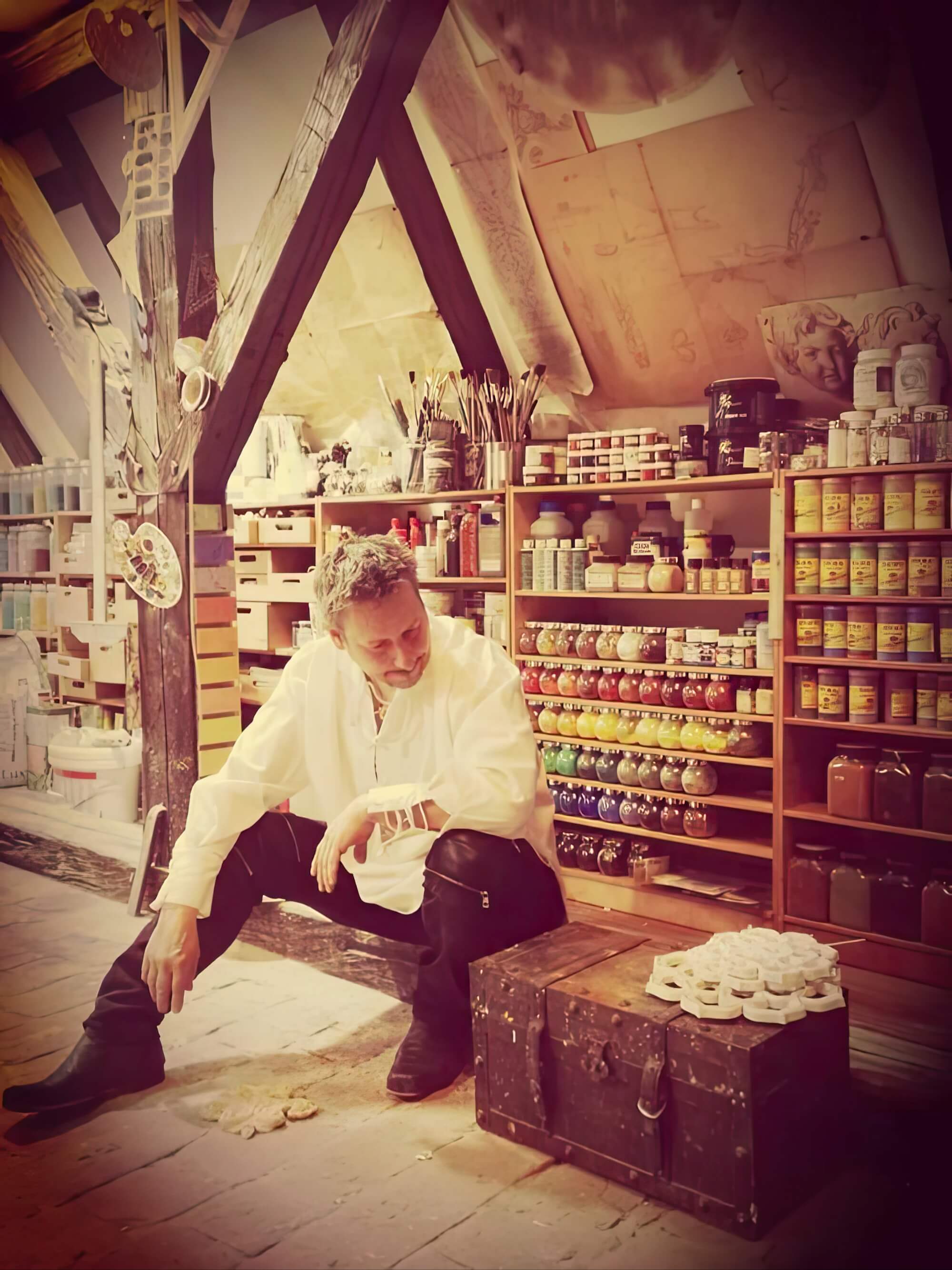 Toni Hamler in his art studio, surrounded by rich pigments and traditional decorative materials, showcasing his expertise in luxury interior artistry.