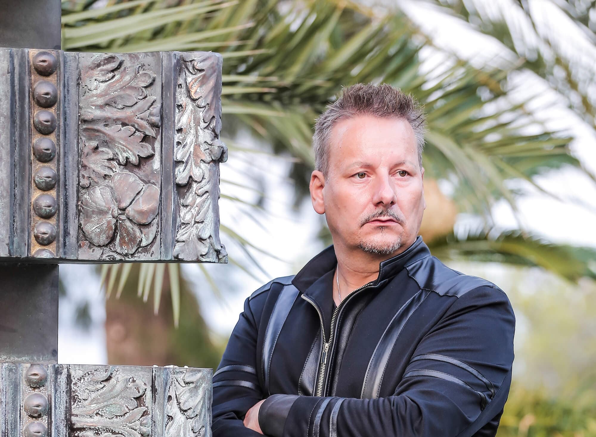 Portrait of Toni Hamler, master decorator and visionary artist, known for transforming luxury interiors, yachts, and fashion into bespoke masterpieces.